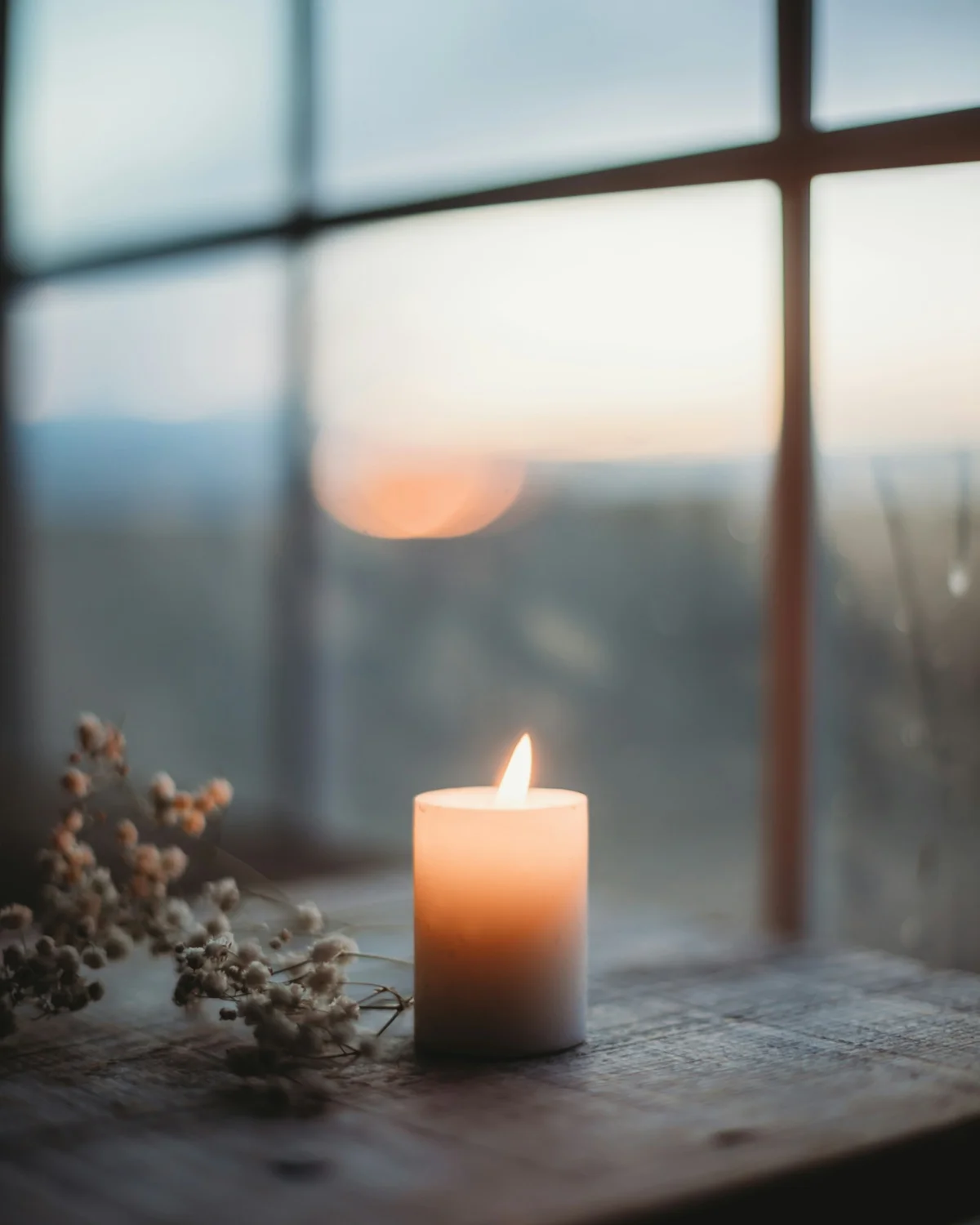 A lit candle on a wooden table — a gentle keepsake scene for Picture to Video AI